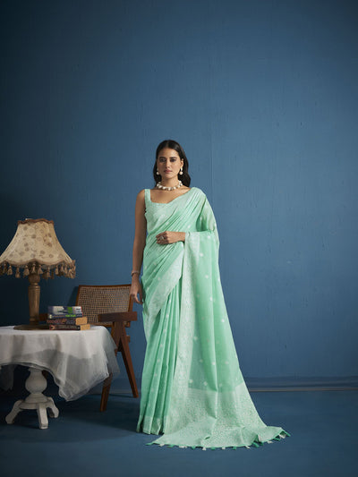 Elora Summer Green Chikankari Soft Linen Lucknowi Saree for women featuring handcrafted Chikankari embroidery, breathable lightweight linen fabric, and elegant pastel tones ideal for festive wear, summer celebrations, and graceful ethnic styling.