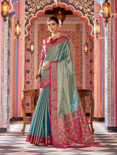 Elora Zari Tissue Solid Banarasi Silk Saree featuring intricate woven jacquard work, luxurious designer drape in rich traditional silk, perfect for weddings, festive wear, and elegant ethnic occasions. Premium Banarasi saree with fine zari detailing and timeless craftsmanship.