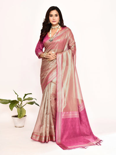 Graceful Faded Pink Plain Tissue Silk Banarasi Saree featuring a lightweight, sheer texture and luxurious handwoven craftsmanship. Ideal for festive wear, weddings, and traditional occasions, this elegant saree blends Banarasi heritage with soft tissue silk for a timeless ethnic look.