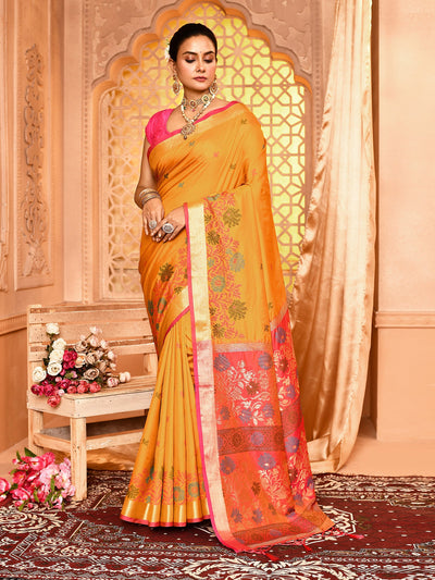 Elegant Saffron Mustard Floral Soft Silk Banarasi Saree featuring traditional golden zari work, intricate floral weaving, and a luxurious soft silk drape perfect for weddings, festive celebrations, and ethnic occasions.