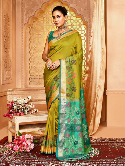 Elegant Tulip Green Floral Soft Silk Banarasi Saree featuring intricate golden zari work, delicate floral motifs, and luxurious soft silk texture  perfect for festive wear, traditional functions, and weddings, highlighting timeless Indian craftsmanship in Banarasi sarees